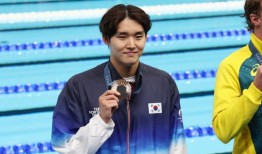 令人印象深刻的职业发展在游泳运动员金宇敏的第一个奥运会奖牌达到高潮